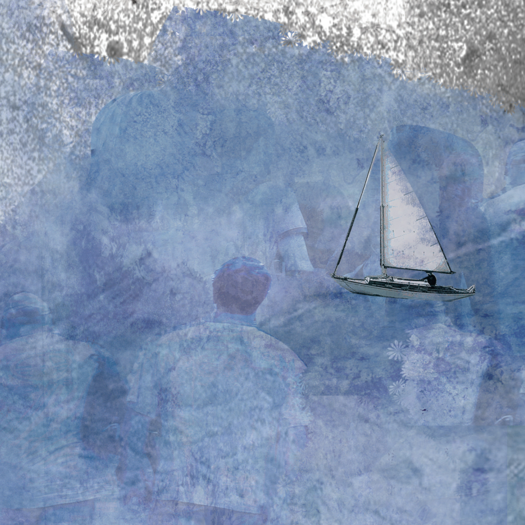 A man watching a small sailing boat